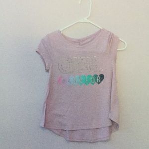 A purple Tee shirt that says girl warrior.